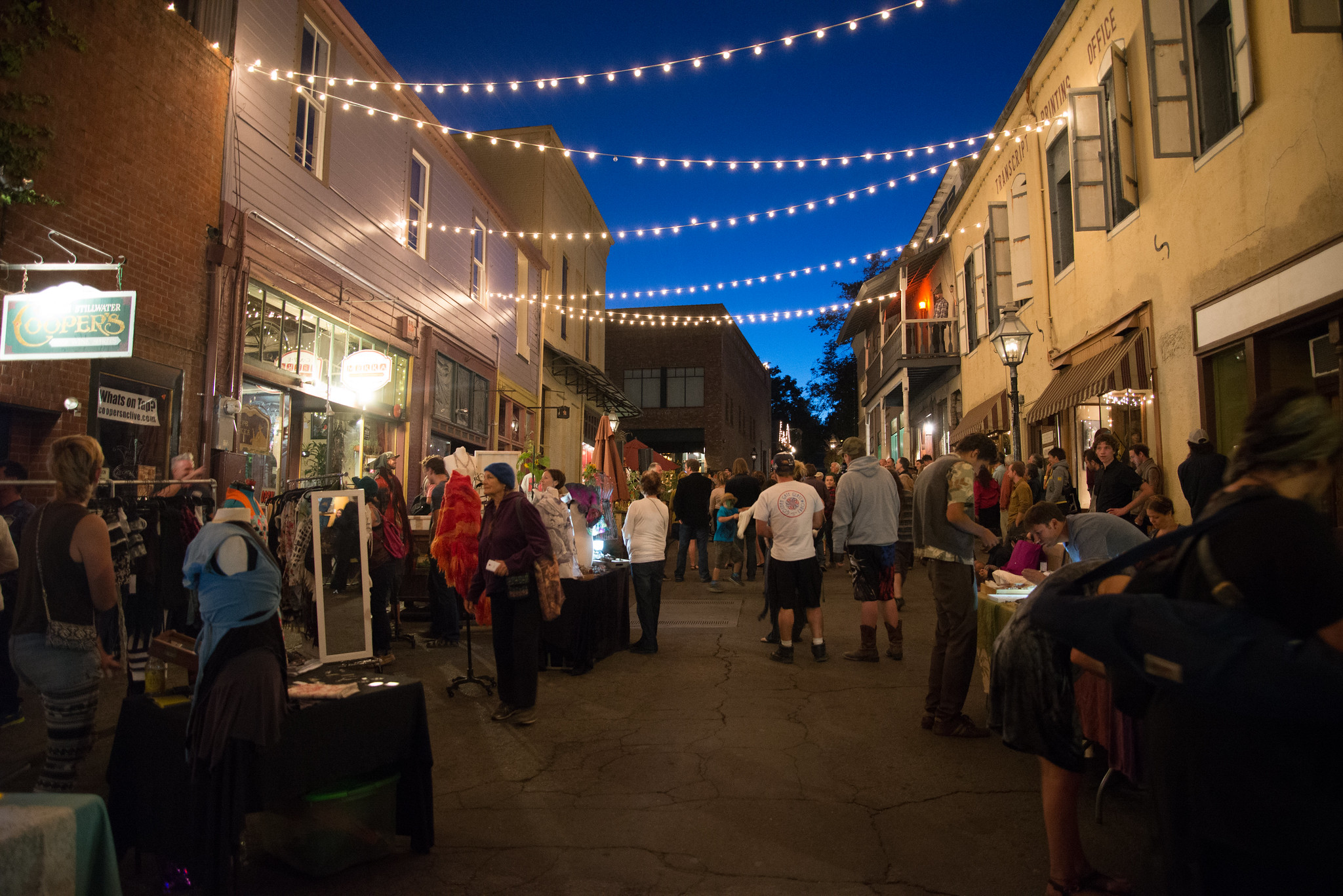 people strolling through First Friday Artwalks in Nevada City California at dusk