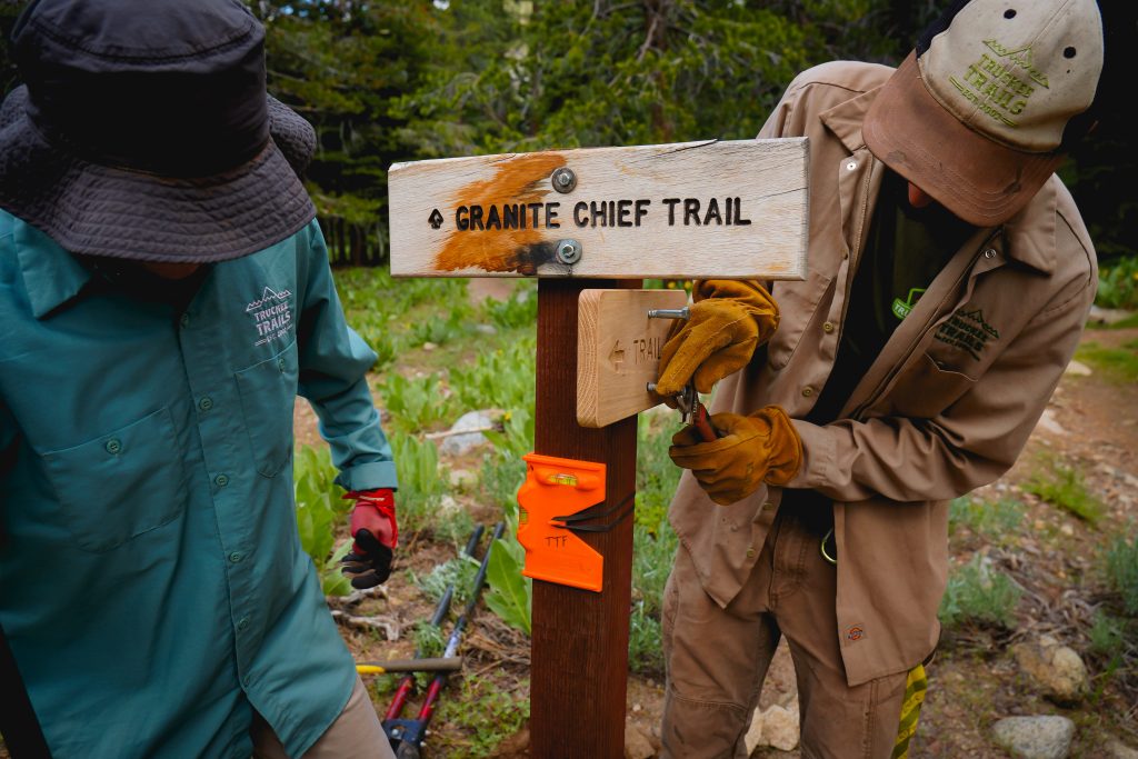 Truckee trails crew working on Granite Chief trail sign