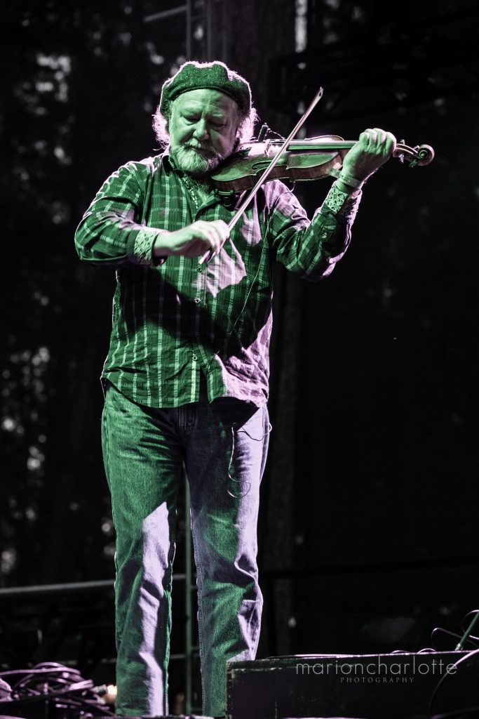 Alasdair Fraser on stage at Celtic Festival in Nevada County playing the violin