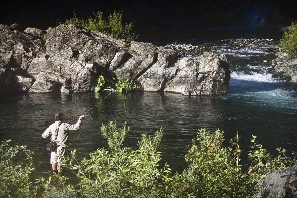 fly fisherman casting on the North Yuba River in Nevada County California