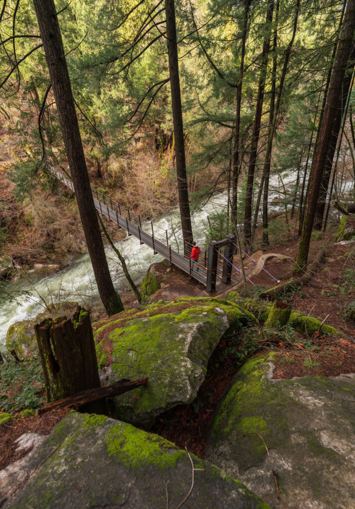 Deer creek tribute trail suspension bridge in the fall or winter