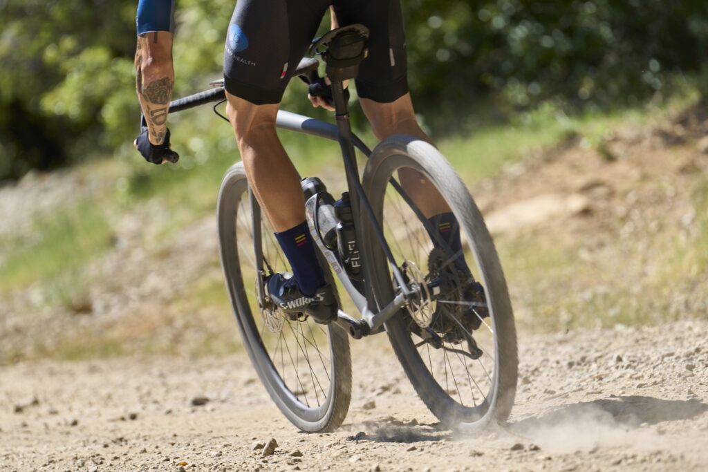 cyclist pedaling on rough gravel road on Heart Of Gold Gravel race