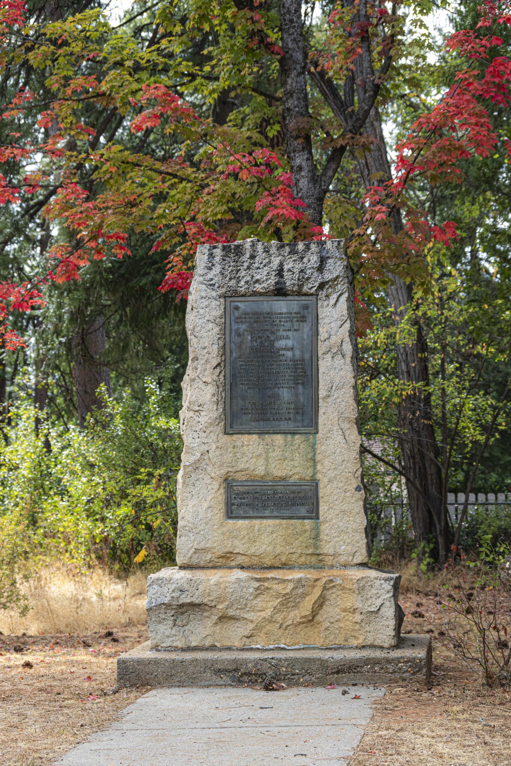 Gold Hill - gold quartz discovery site with fall foliage in the background