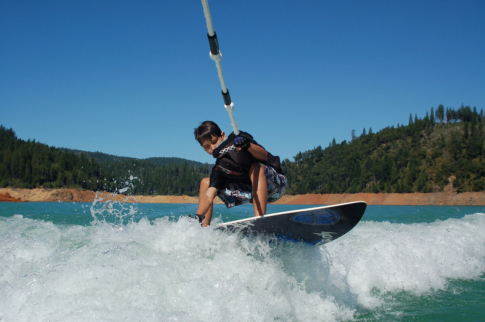 wakeboarding on an alpine lake in Nevada County